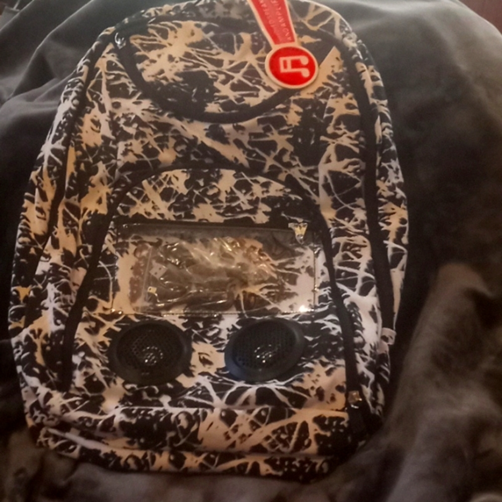 A book bag with built-in speakers compatible with most phones brand new with tag